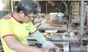 Hundred-year-old copper casting village with fire to cook the last batch of the year 